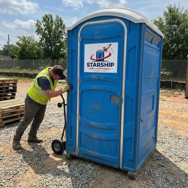 Starship porta potty delivery at construction site in Greensboro
